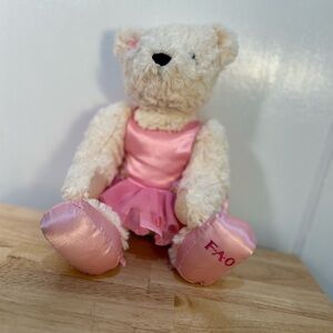 FAO Schwartz Gently Used Teddy Bear in Pink Dress